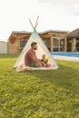 Father playing with his son in the backyard Royalty Free Stock Photo