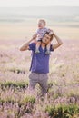 Father playing with his son in a lavender field Royalty Free Stock Photo