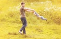 Father playing with son child having fun outdoors in sunny summer Royalty Free Stock Photo