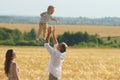 Father playing with son on the wheat field Royalty Free Stock Photo