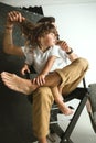 Father playing with young son in their sitting room Royalty Free Stock Photo