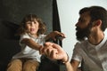 Father playing with young son in their sitting room Royalty Free Stock Photo