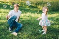 Father plays with his daughter with soapbubble Royalty Free Stock Photo