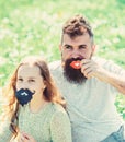 Father posing with lips and child posing with beard photo booth attribute. Gender roles concept. Family spend leisure Royalty Free Stock Photo