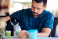 Father Preparing Baby Formula in Milk Bottle for Newborn