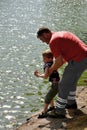 Man prevents a little boy from jumping into a river