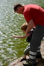 Man prevents a little boy from jumping into a river