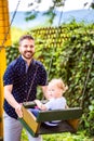 Father pushing his daughter on swing in a park. Royalty Free Stock Photo