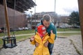 Father pushing his little daughter with Down syndrome on swing outdoors in playgraound. Royalty Free Stock Photo