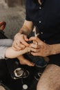 Father puts shoes on child. Close-up of a man\'s hands and shoes on a child\'s foot