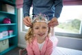 Father putting a tiera on daughters head Royalty Free Stock Photo