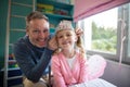 Father putting a tiera on daughters head Royalty Free Stock Photo