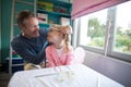 Father putting a tiera on daughters head