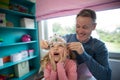 Father putting a tiera on daughters head Royalty Free Stock Photo