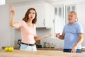 Father quarrel with adult daughter members in kitchen