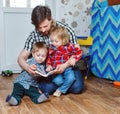 Father reading a book to children Royalty Free Stock Photo