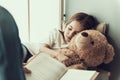 Father Reading Book to Sleeping Little Girl Royalty Free Stock Photo