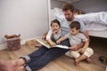 Father Reading Story To Children In Their Bedroom Royalty Free Stock Photo