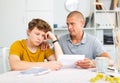 Father reassures his son after reading letter from college