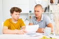Father reassures his son after reading letter from college