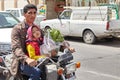 Father riding on a motorcycle with her daughter, Kashan, Iran.