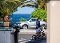 Tenerife, Spain, April 2020. Father riding with a small child riding a bicycle with masks and gloves