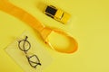 father's day concept, creative glasses, tie, toy car, mocap postcard in yellow colors, letterhead envelope