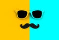 Father`s day concept. Hipster sunglasses and funny moustache on yellow and blue background