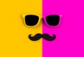 Father`s day concept. Hipster sunglasses and funny moustache on yellow and pink background