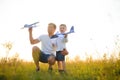 Father's day. dad and baby son playing together outdoors plane Royalty Free Stock Photo