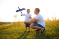 Father's day. dad and baby son playing together outdoors plane Royalty Free Stock Photo