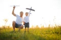 Father's day. dad and baby son playing together outdoors plane Royalty Free Stock Photo