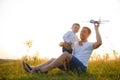 Father's day. dad and baby son playing together outdoors plane Royalty Free Stock Photo