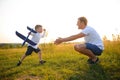 Father's day. dad and baby son playing together outdoors plane Royalty Free Stock Photo