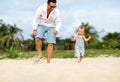 Father`s day. Dad and baby son playing together outdoors on a su Royalty Free Stock Photo