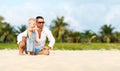 Father`s day. Dad and baby son playing together outdoors on a su Royalty Free Stock Photo