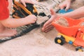 Father`s day. Dad and son. Little son plays toys with dad on the beach with sand. Royalty Free Stock Photo