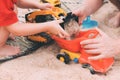 Father`s day. Dad and son. Little son plays toys with dad on the beach with sand. Royalty Free Stock Photo