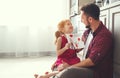 Father`s day. Happy family daughter giving dad greeting card Royalty Free Stock Photo