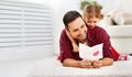 Father`s day. Happy family daughter giving dad greeting card Royalty Free Stock Photo