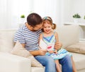 Father`s day. Happy family daughter giving dad greeting card Royalty Free Stock Photo