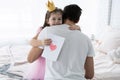 Father`s day. Happy family daughter giving dad a greeting card on holiday. Royalty Free Stock Photo