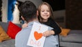 Father\'s day. Happy family daughter holding a greeting card on holiday and hugging her father Royalty Free Stock Photo