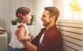 Father`s day. Happy family daughter hugging dad and laughs Royalty Free Stock Photo