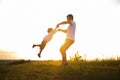 Father& x27;s day. Happy family father and toddler son playing and laughing on nature at sunset Royalty Free Stock Photo