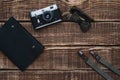 Father`s day with men`s accessories bow tie, wallet, retro camera, suspenders and notepad and leather shoes on a wooden backgrou