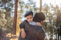 Father`s day. Sad son hugging dad on the  forest background  with copy space. Concept of father-son relationship Royalty Free Stock Photo