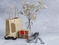 Father`s day shopping bag and gift with tools on gray. Royalty Free Stock Photo