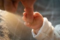 Father`s hand holding his newborn baby hand Royalty Free Stock Photo