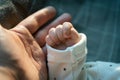 Father`s hand holding his newborn baby hand Royalty Free Stock Photo